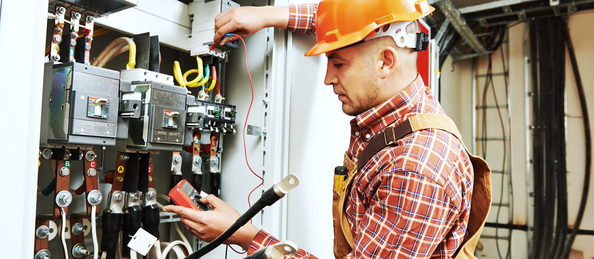 electrician holding a multimeter